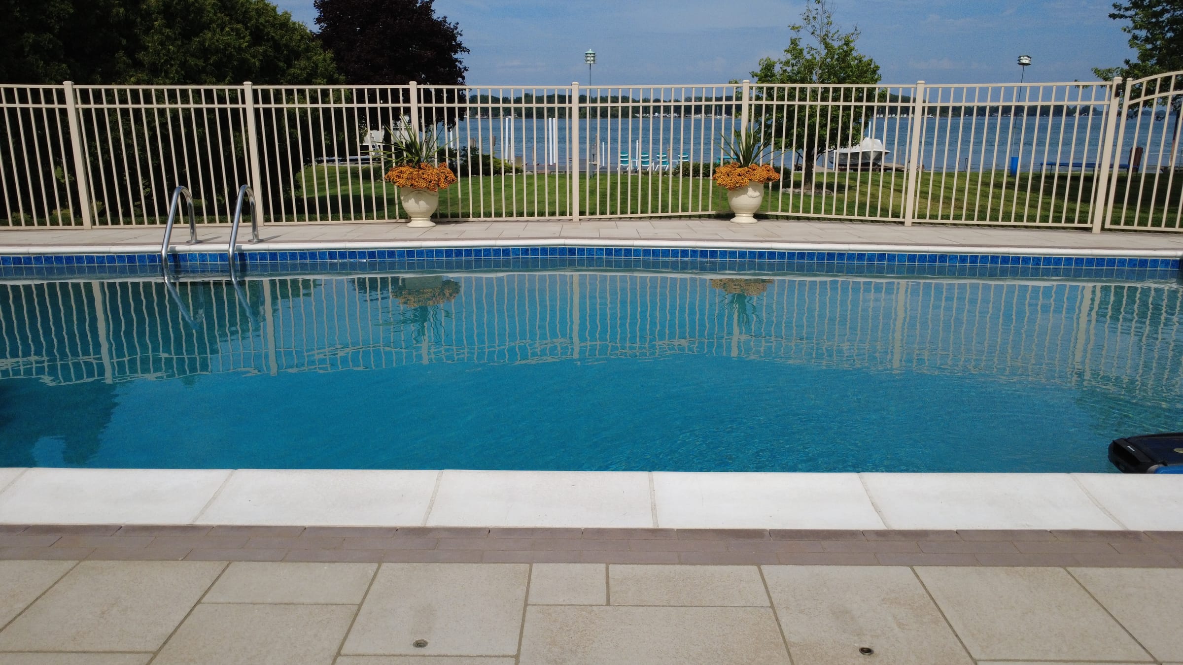 Paver pool surround with a defined border edge at a Downriver Michigan property