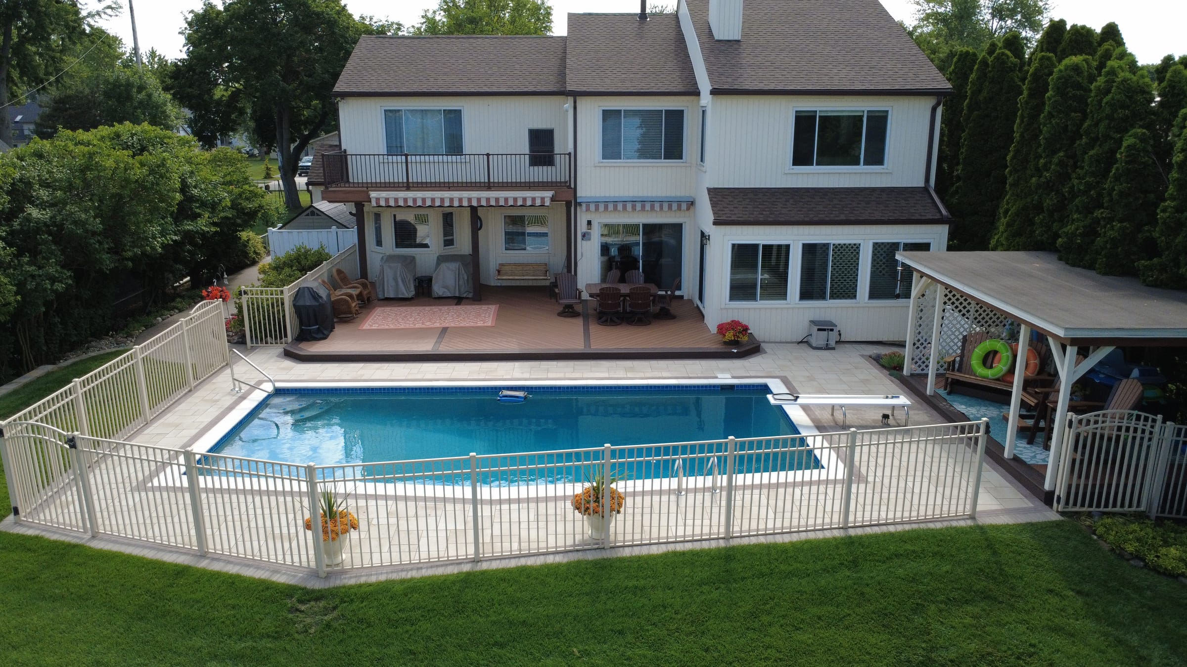Finished pool deck and backyard by Gabriel's Pavers in Gibraltar, MI